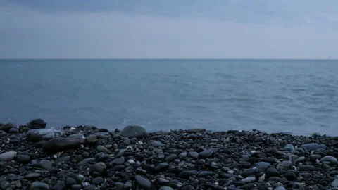 Beach at sunset, the wave hits the shore Stock Footage 104522604