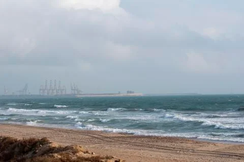 Beach at sunset with waves Stock Photos