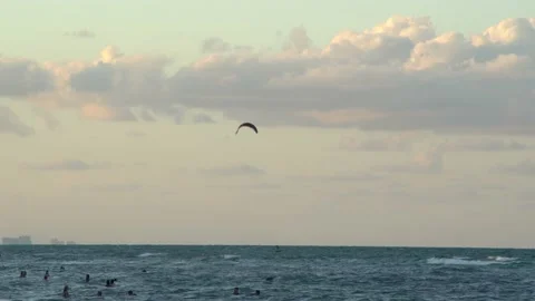 Beach surfing at sunset Stock Footage 133024565