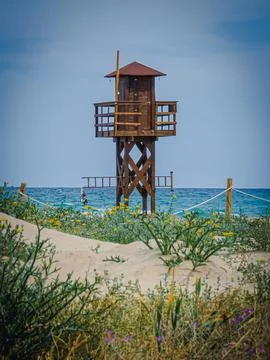 Beach Surveillance Tower Under a Clear Blue Sky in Spain Stock Photos