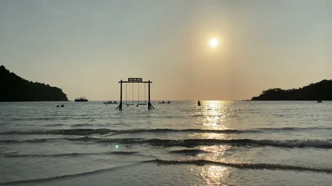Beach swing and watching ocean waves. Stock Footage 197057577