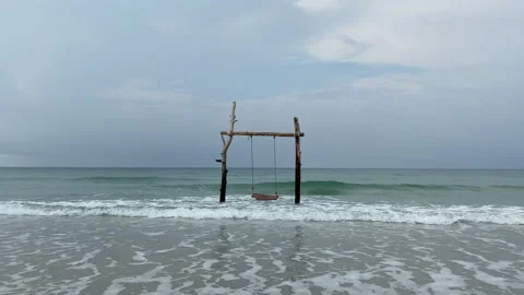 Beach swing and watching ocean waves. Stock Footage 197058827