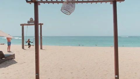 Beach swing frame by turquoise sea , Nusa Dua, Bali 動画素材 339777348