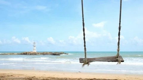 Beach Swing with Lighthouse in Tropical Landscape Vídeos de archivo 337969595