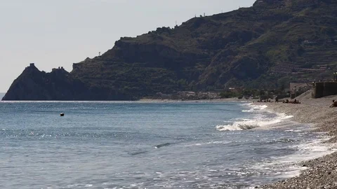 The beach of Taormina in Sicily Stock Footage 83444257
