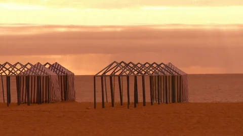 Beach tents at sunset Stock Footage 159972