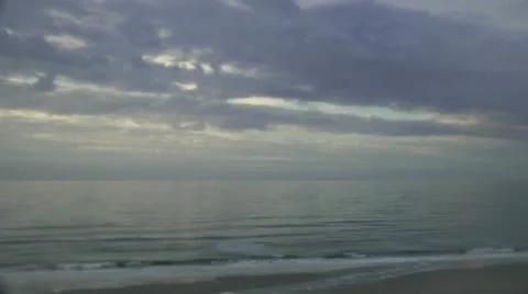 Beach timelapse of cloud filled sky, surf, and seashore Stock Footage 11092854