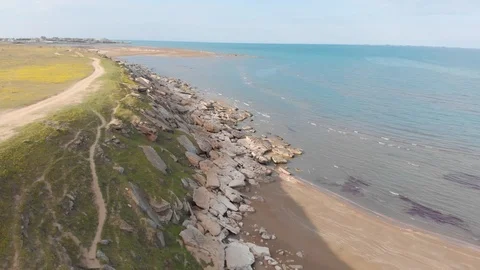Beach top view, waves break on tropical yellow sand beach. Sea waves on yellow Stock Footage 127357792