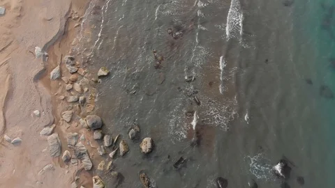 Beach top view, waves break on tropical yellow sand beach. Sea waves on yellow Stock Footage 127357943