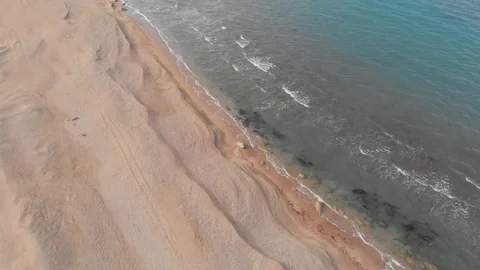 Beach top view, waves break on tropical yellow sand beach. Sea waves on yellow Stock Footage 127358017