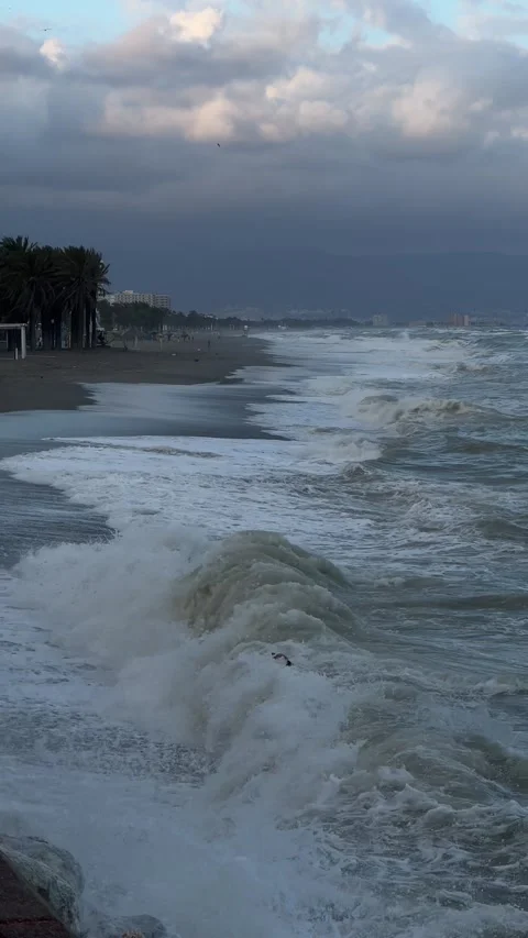 Beach of Torremolinos during storm in evening. Vertical video Stock Footage 240921670