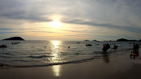 The beach with tourists at sunset. Video stock 100631497