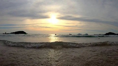 The beach with tourists at sunset. Stock Footage 100631706