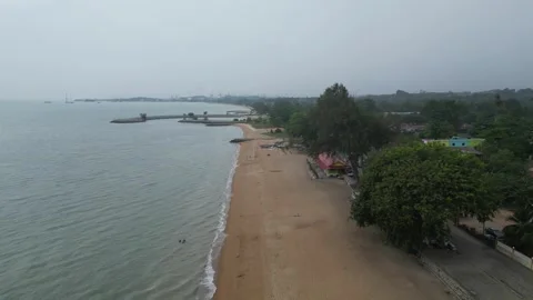 A beach with a town in the background. Aerial view Tanjong Bidara, Melaka 動画素材 314389950