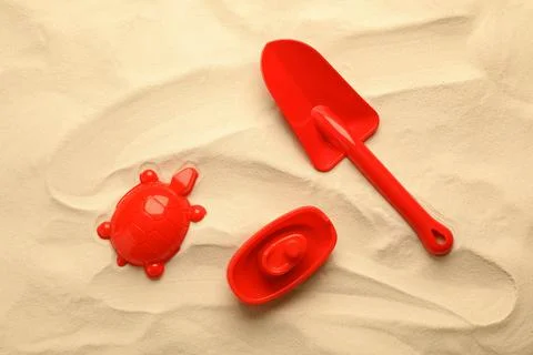 Beach toy kit on sand, flat lay. Outdoor play 写真素材