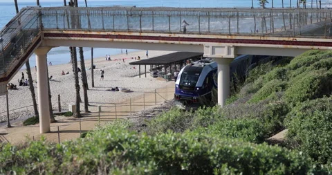 Beach Train Passing Under Bridge Stock-Footage 232542272