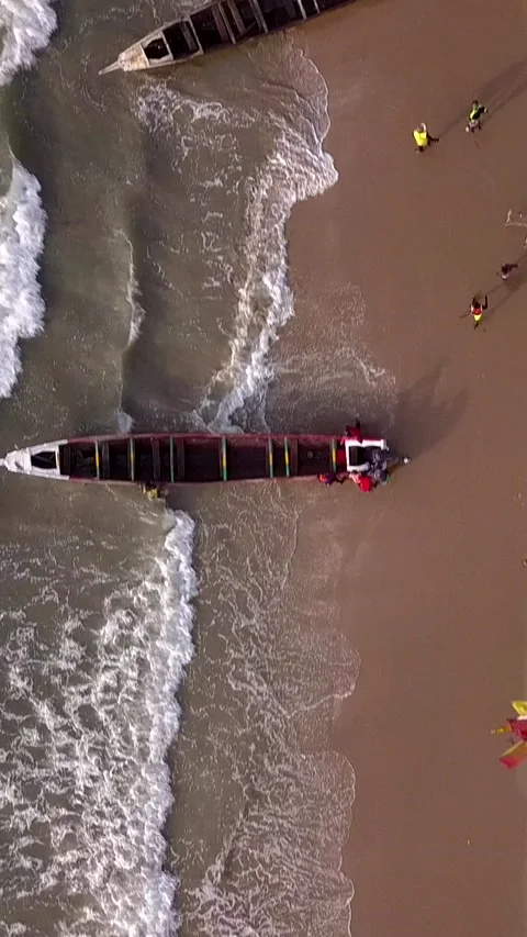 Beach with trees, people walking and traditional fishing boats Video stock 230668348