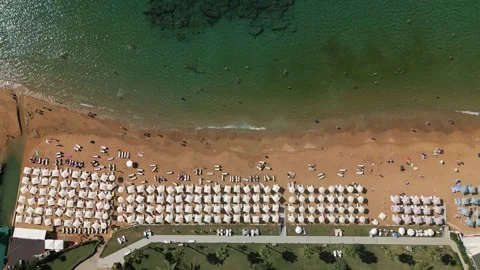 Beach in Turkey with umbrellas and bathing people Stock Footage 256925950