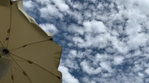 A Beach Umbrella Blowing In The Wind Video stock 147605705