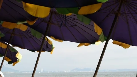 Beach umbrella with blue sky Stock Footage 75577411