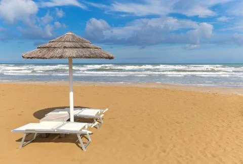 Beach umbrella with chairs Foto stock
