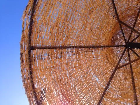 The beach umbrella is handmade. Stock Photos