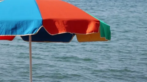 Beach umbrella on the left Stock Footage 76968605