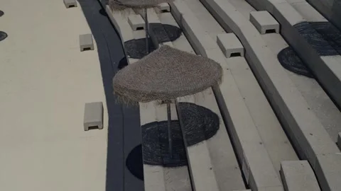 Beach umbrella over empty swimming pool Castanheira de Pera Portugal Stock Footage 331686237