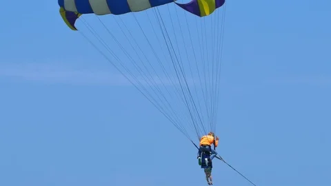 Beach umbrella, parachuting Stock-Footage 75053690