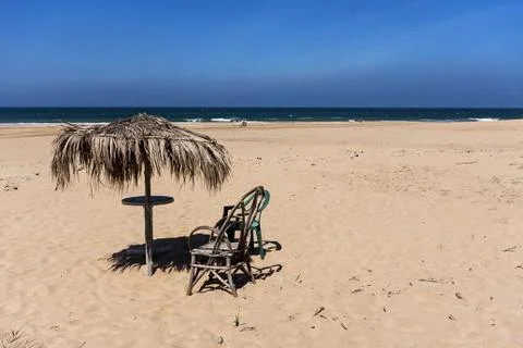 Beach with umbrella Stock Photos