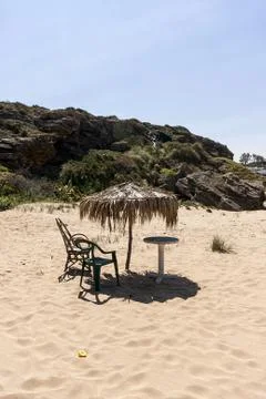 Beach with umbrella Stock Photos