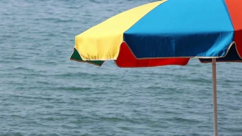Beach umbrella on the right Stock Footage 76968625