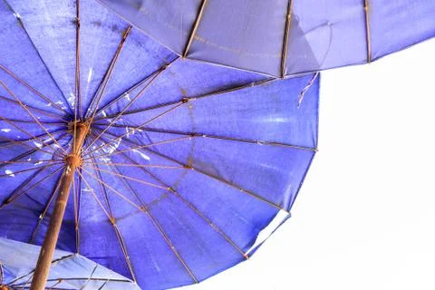 Beach umbrella with rust Stock Photos