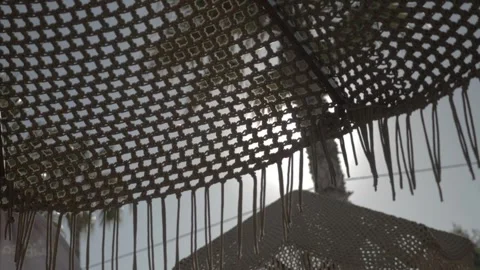 Beach umbrella sunrays island macrame Video stock 327875368