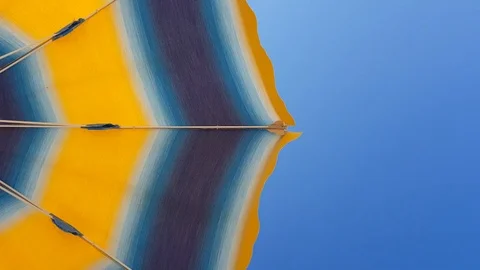 Beach umbrella sways 스톡 동영상 113994521