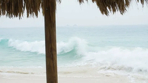 Beach Umbrella Waves Slow Motion Stock Footage 89054255