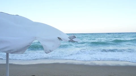 Beach umbrella in the wind Stock Footage 94368391