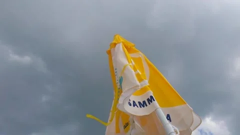 Beach umbrella in the wind Stock Footage 165386341