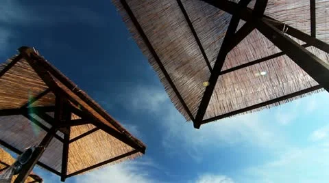 Beach umbrellas and clouds. Stock Footage 21931715
