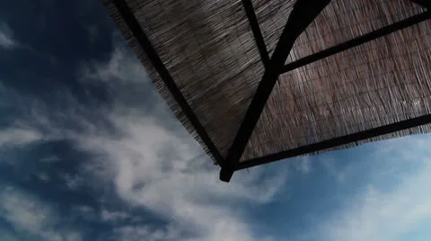 Beach umbrellas and clouds. Stock Footage 24868574