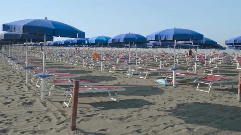 Beach umbrellas and empty places after covid19, summer 2020, August, Italy. Some Stock Footage 136558745