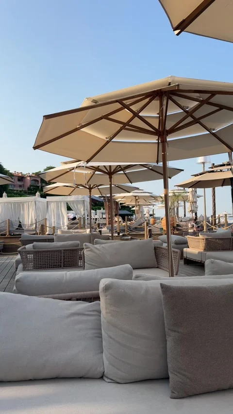 Beach umbrellas and lounge seating at Odesa seaside resor Stock Footage 339732331