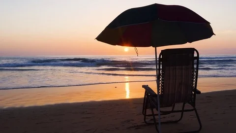 Beach with umbrellas and sun loungers Sunset at Phuket beach, Thailand Stock Footage