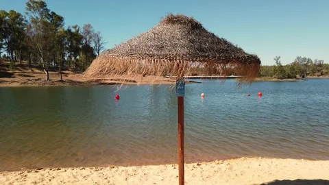 Beach umbrellas on a background of blue sky. Video stock 134977454