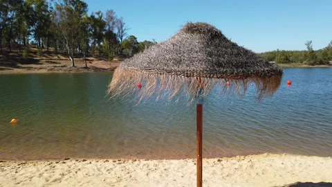 Beach umbrellas on a background of blue sky. Video stock 134977502
