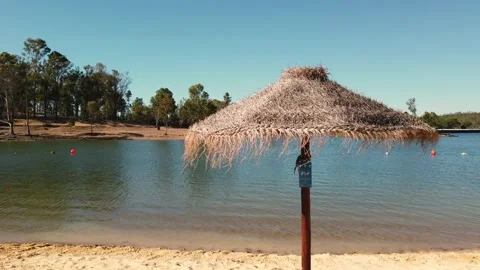 Beach umbrellas on a background of blue sky. Video stock 134977707