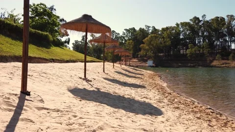 Beach umbrellas on a background of blue sky. Stock Footage 134977792