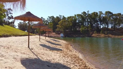 Beach umbrellas on a background of blue sky. Stock Footage 134977844