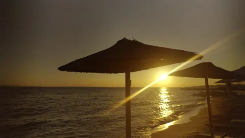 Beach umbrellas on a beach Stockbeeldmateriaal 212983684