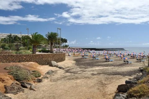 Beach with umbrellas, Lanzarote Stock Photos